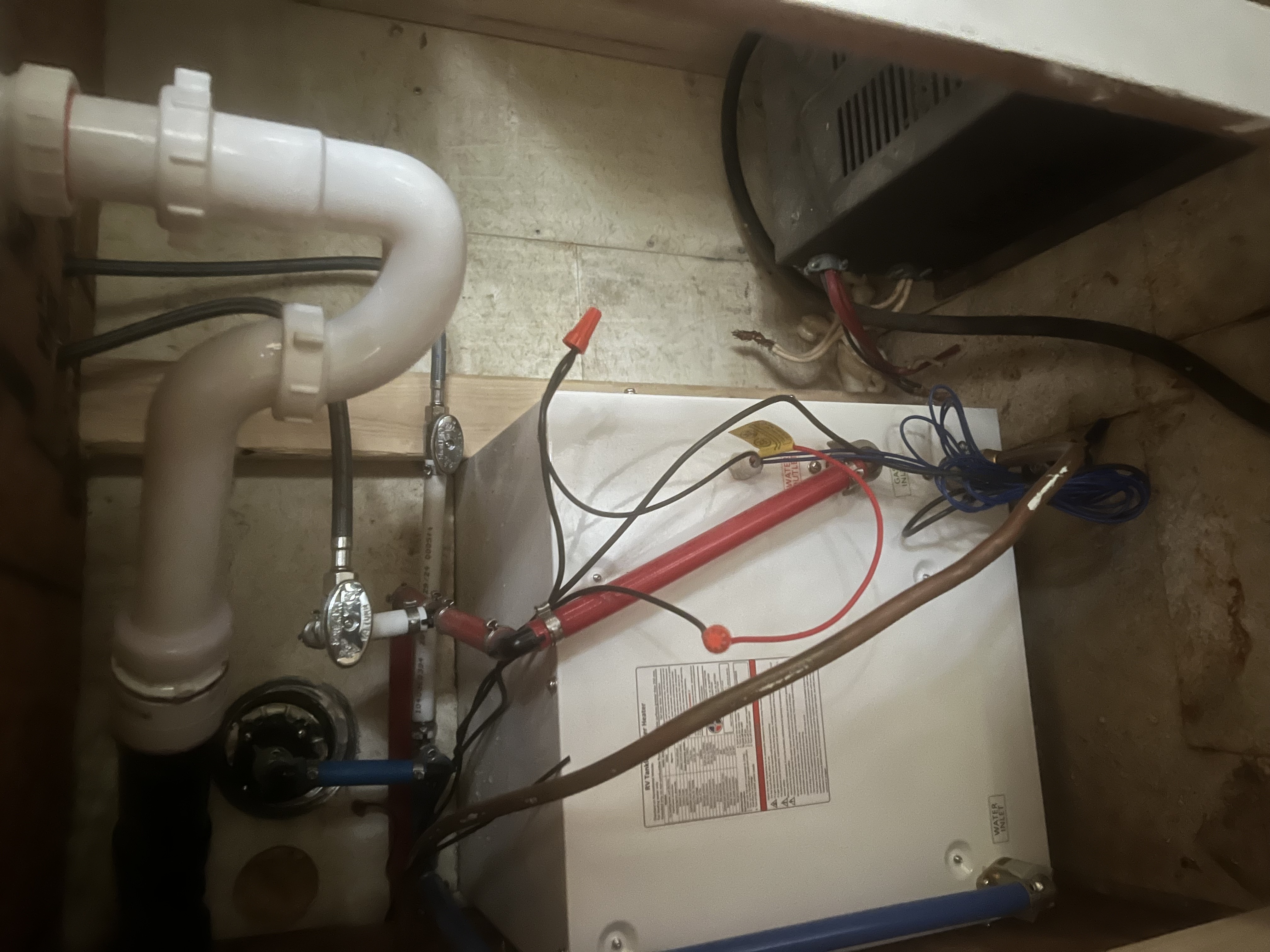 Precision plumbing: clean P-trap and supply plumbing installation