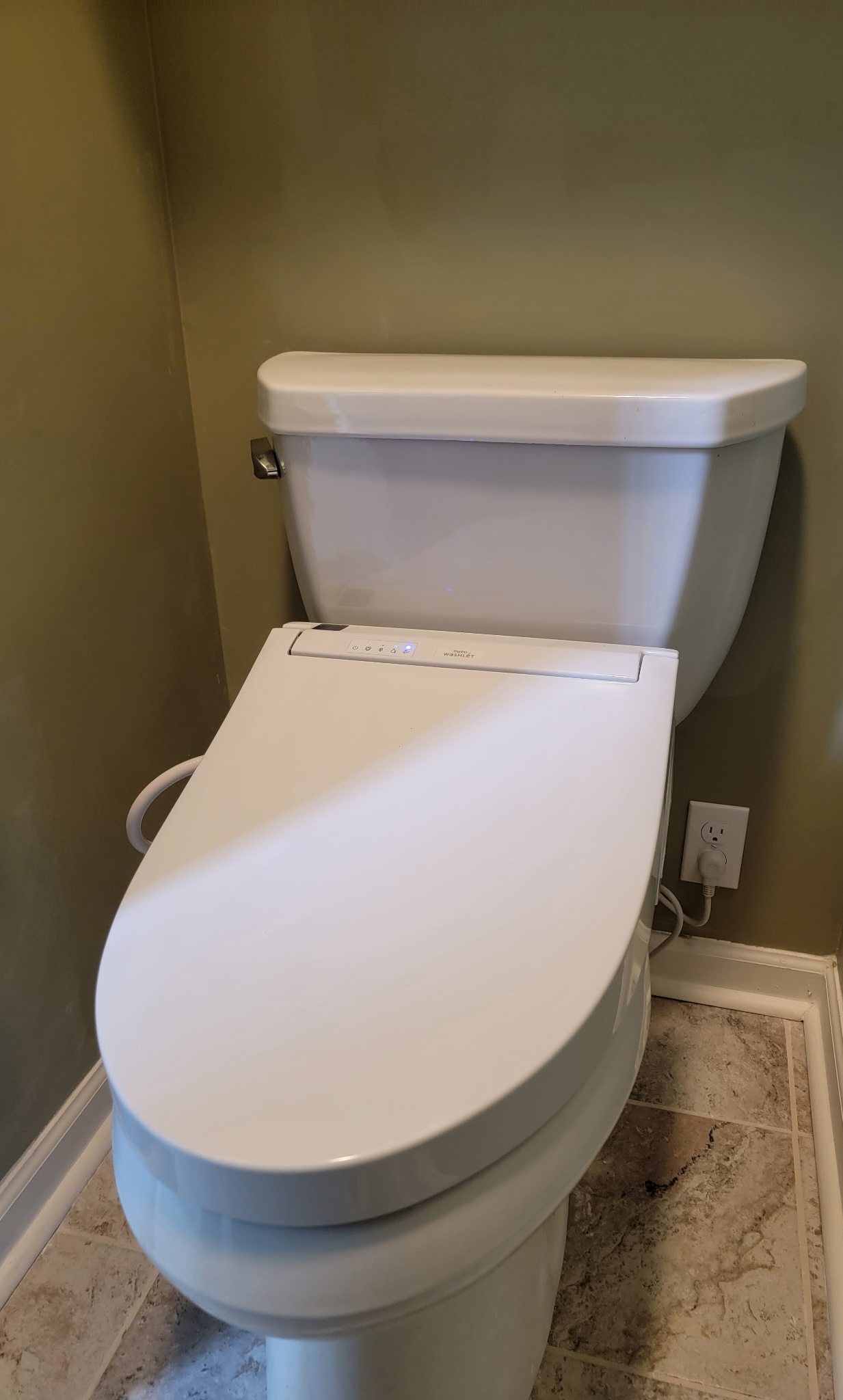 Bidet outlet after: finished outlet and painted wall