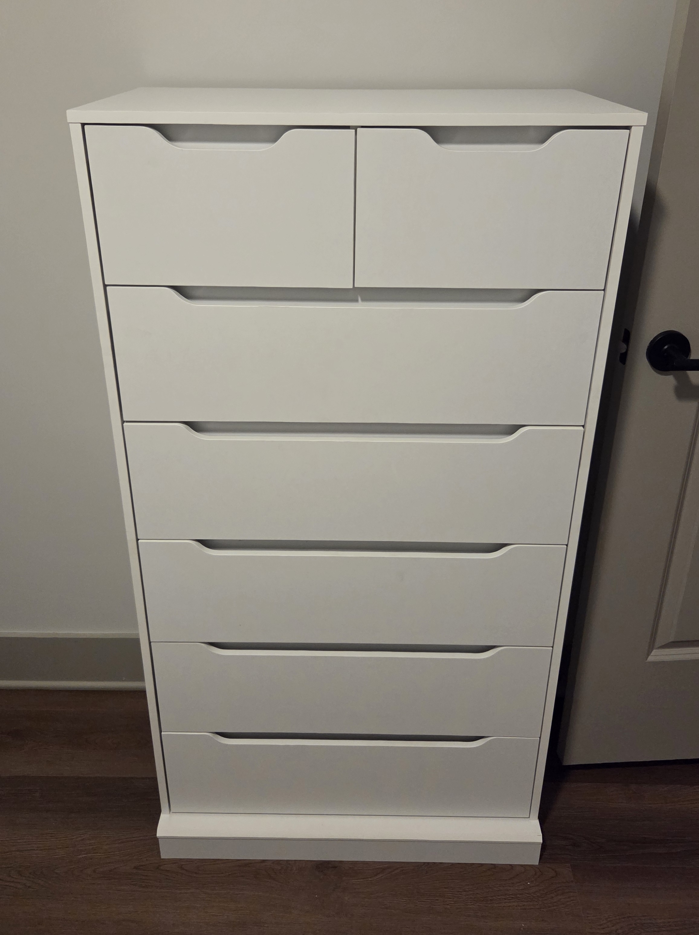 Furniture assembly: dresser drawers aligned and installed